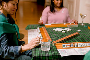 Mahjong accessories in use on a game cloth