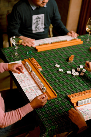 American Mahjong tiles and discards on a game cloth