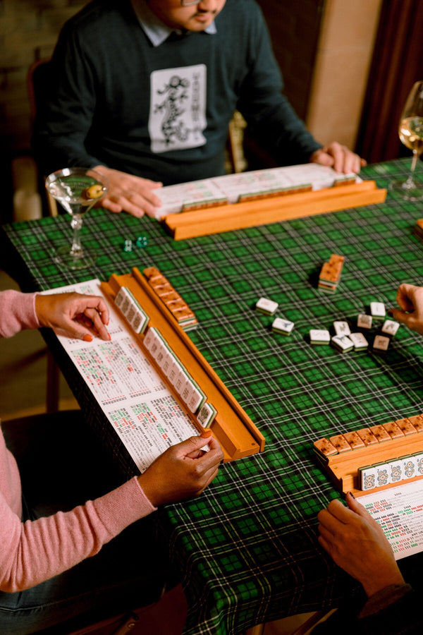 American Mahjong tiles and discards on a game cloth