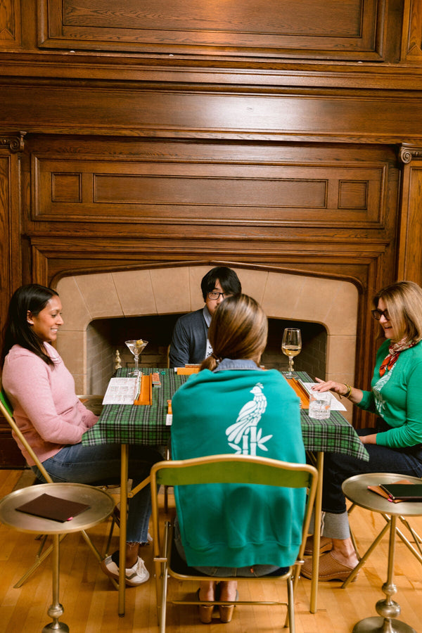 A styled mahjong game night with friends around the table