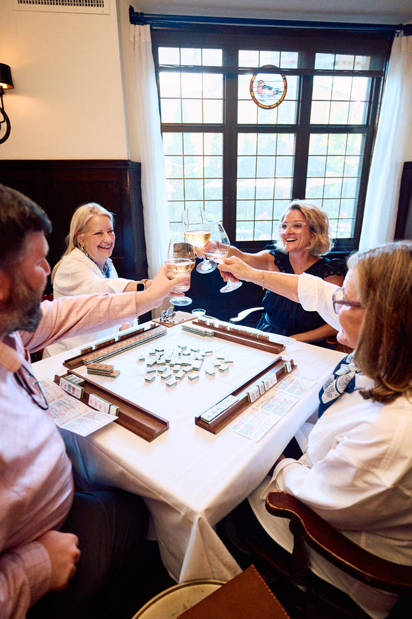 Members of a mahjong club playing together