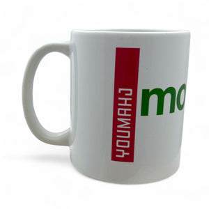 White mug with red and green text on a white background