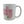 White mug with red and green design on a white background