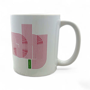 White mug with red and green design on a white background