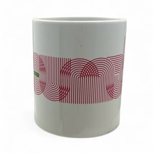 White mug with red geometric pattern on a white background